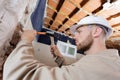 low angle view builder using hammer and chisel Royalty Free Stock Photo