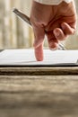 Low angle view of businessman hand pointing with his finger whe