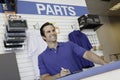 Low angle view of car mechanic standing at the counter