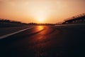 Low angle view chicane on race track track at sunset. Generative AI Royalty Free Stock Photo