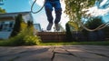 Low angle view of a child jumping rope outdoors Royalty Free Stock Photo