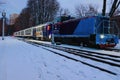 Low-angle view of Christmas decorated train by lights. Train arrived at the station