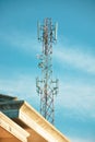 Low angle view of communications tower against sky