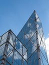 Low angle view of Contemporary Metallic Skyscrapers against blue sky,