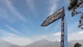 Low Angle View of a Wooden Road Sign of Floating Store Directional