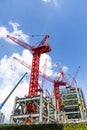 View of cranes above steel structure for building construction. Royalty Free Stock Photo