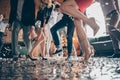 Low angle view cropped close-up photo of legs girls guys meeting rejoicing dance floor x-mas party glitter flying air Royalty Free Stock Photo