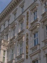 Low angle view of the decorative facade of famous luxury Hotel Sacher in the historic center of Vienna, Austria.