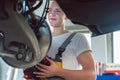 Dedicated mechanic working in a modern automobile repair shop