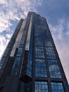 Low angle view of Devon Tower in Calgary downtown with glass facade in postmodern style located at 3 Ave SW.
