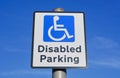 Disabled Parking sign against a blue sky. Royalty Free Stock Photo