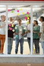 Business people discussing over sticky notes in the office Royalty Free Stock Photo