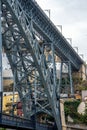 Low angle view of the Don Luis I steel bridge in Porto and people walking and taking photos of the Douro River on the upper Royalty Free Stock Photo