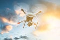 Drone flying against cloudy sky during sunset Royalty Free Stock Photo
