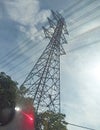 Low Angle View of Electricity Pylon with Sun Flare Royalty Free Stock Photo
