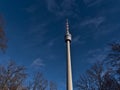 Low angle view of famous tv tower Stuttgart Fernsehturm located in district Degerloch in Stuttgart, Germany surrounded by forest.