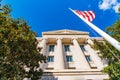Low angle view of a federal building with columns and flag Royalty Free Stock Photo