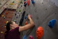 Low angle view female athlete climbing wall Royalty Free Stock Photo