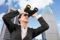 Female manager using binoculars at outdoors Royalty Free Stock Photo