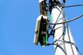 Low angle view of fibre optic network cables in the street on a pillar Royalty Free Stock Photo