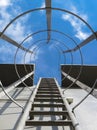 Low angle view of fire escape staircase on the wall of the building Royalty Free Stock Photo