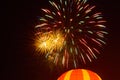 Low angle view of firework and balloon against sky at night Royalty Free Stock Photo