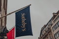 Low angle view of the flag outside Sotheby`s auction house on New Bond Street in London, UK