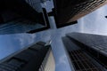 low angle view of four skyscrapers with different facade designs under the blue sky