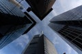 low angle view of four skyscrapers with different facade designs under the blue sky