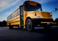 Low angle view of the front door side entrance of a yellow American public school bus used to transport kids to school, field Royalty Free Stock Photo