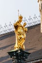 Low angle view of gold mother and child statue Royalty Free Stock Photo