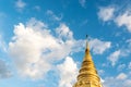 Low angle view golden pagoda with blue sky and beautiful cirrus