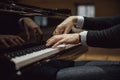 Low angle view of hands of a pianist playing pian