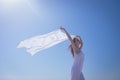 Beautiful woman holding scarf at beach Royalty Free Stock Photo