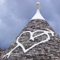 Low angle view of a heart shape painted on a trulli house