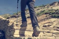Low angle view of hikin boots ascending steps. Royalty Free Stock Photo
