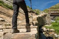 Low angle view of hikin boots ascending steps. Royalty Free Stock Photo