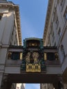 Low angle view of the historic music box Ankeruhr in the old downtown of Vienna, Austria between two old buildings. Royalty Free Stock Photo