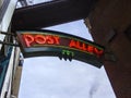 Low angle view of the historic Post Alley neon sign