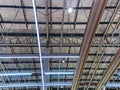Low Angle View of Illuminated Warehouse Ceiling