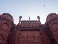 A low angle view of the indian flag flying above lahori gate at red fort in old delhi Royalty Free Stock Photo