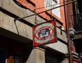 Low-angle view of the Kerry Irish Pub sign hanging from the side of a building in New Orleans Royalty Free Stock Photo