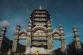 Low angle view of a lady praying to Reclining Buddha - Linh Ung Pagoda, Da Nang, Vietnam - Relics Tower at the Linh Ung Pagoda Royalty Free Stock Photo