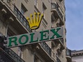 Low angle view of the logo of Swiss luxury watch designer Rolex SA on the facade of an old building in Vienna Austria.