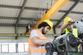 Low angle view of manual workers working on machinery in metal industry Royalty Free Stock Photo