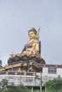 Low angle view of massive statue of Padmasambhava Guru Rinpoche in Rewalsar lake Tso Pema, Himachal Pradesh, India