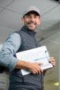 low-angle view mature engineer carrying clipboard Royalty Free Stock Photo