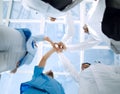 Doctors and nurses in a medical team stacking hands Royalty Free Stock Photo