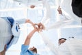 Doctors and nurses in a medical team stacking hands Royalty Free Stock Photo