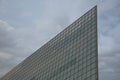 Low angle view of modern building with many windows against cloudy sky Royalty Free Stock Photo